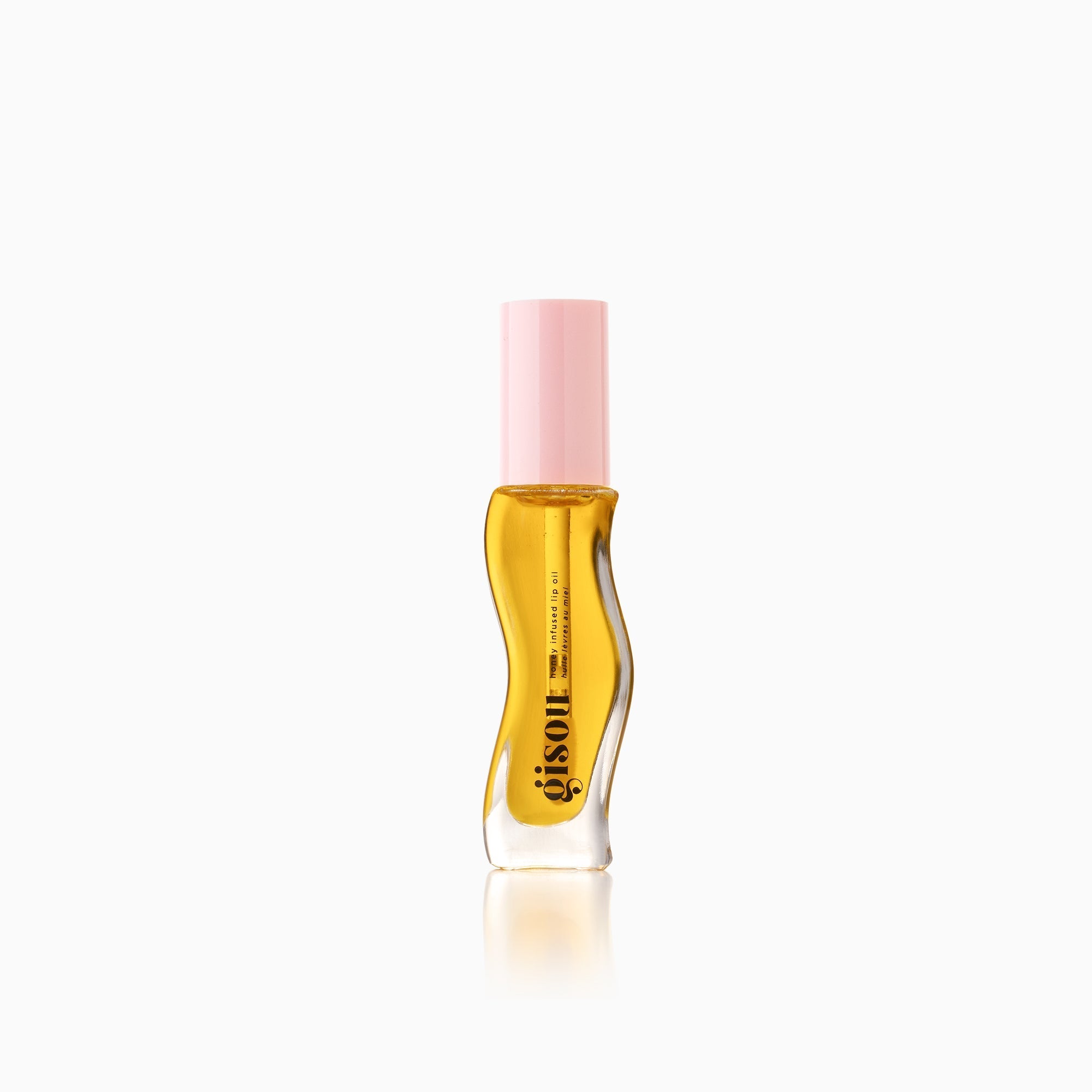 Lip oil bottle with a pink cap.