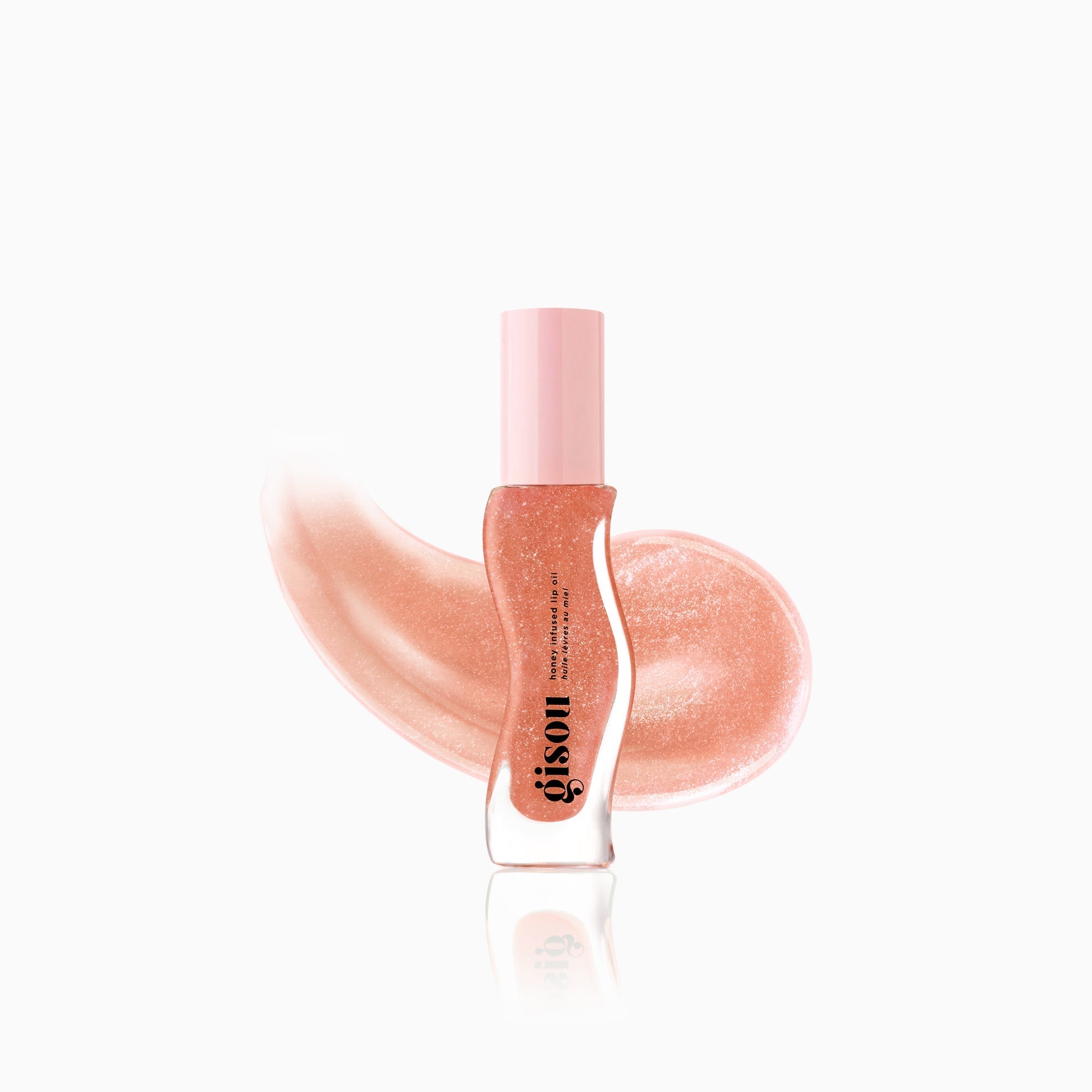 Plum shimmer lip oil including swatch. 