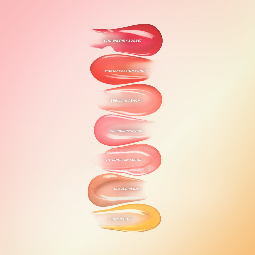 All 7 Gisou lip oil colours swatched.