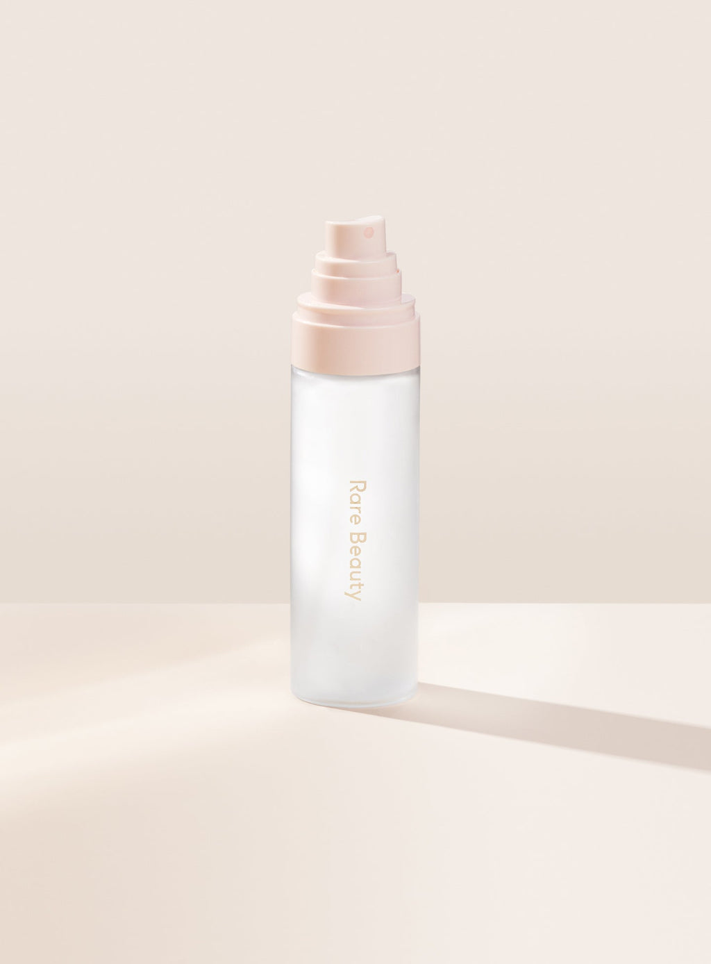 | Rare Beauty's Always an Optimist 4-In-1 Mist with the cap off, designed to hydrate, prime, set, and refresh skin. 