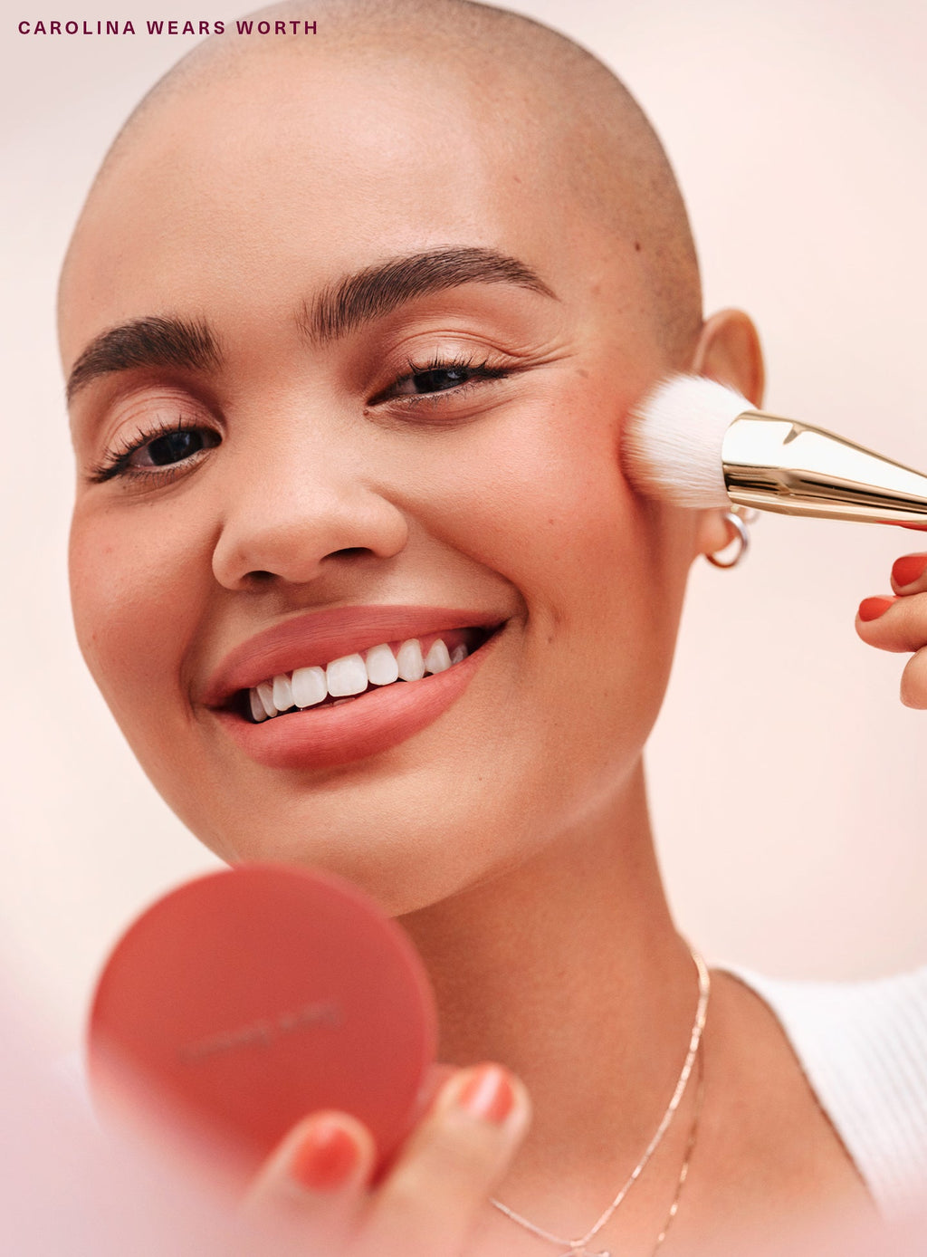 Worth| Model Carolina applying Rare Beauty's Soft Pinch Matte Bouncy Blush in the shade Worth.
