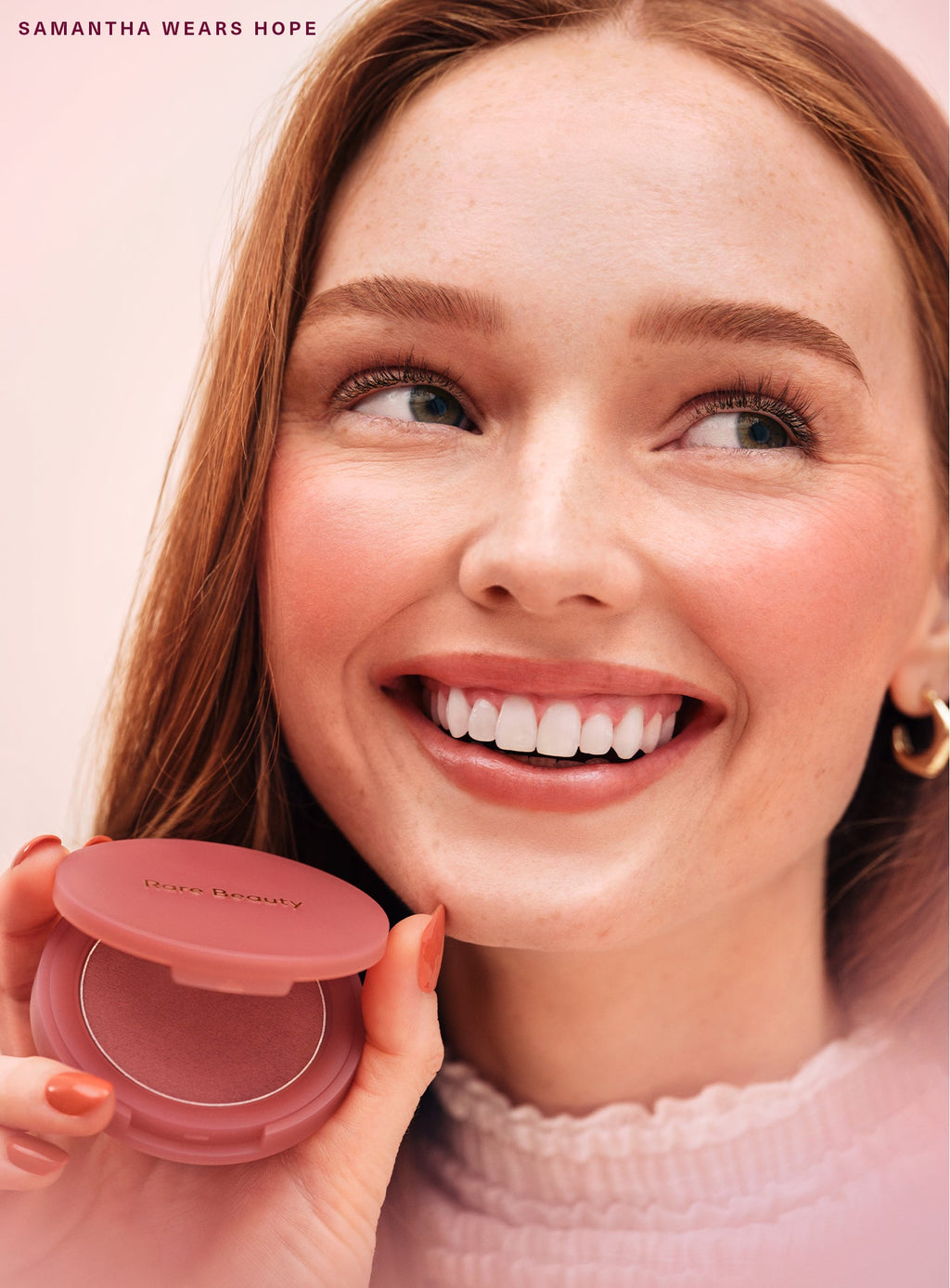 Hope| Model Samantha wearing Rare Beauty's Soft Pinch Matte Bouncy Blush in the nude mauve shade Hope.