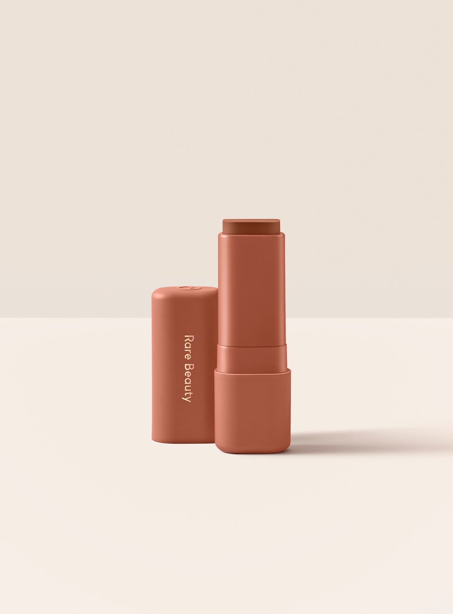 Friendly| Rare Beauty Find Comfort Lip Butter in shade Friendly, a muted caramel color 
