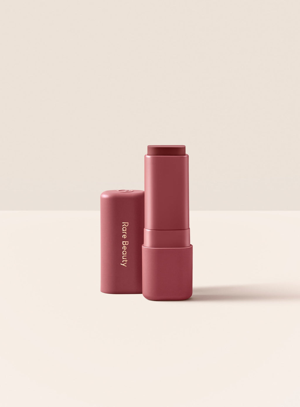 Uplifting| Rare Beauty Find Comfort Lip Butter in shade Uplifting, a deep cool berry color