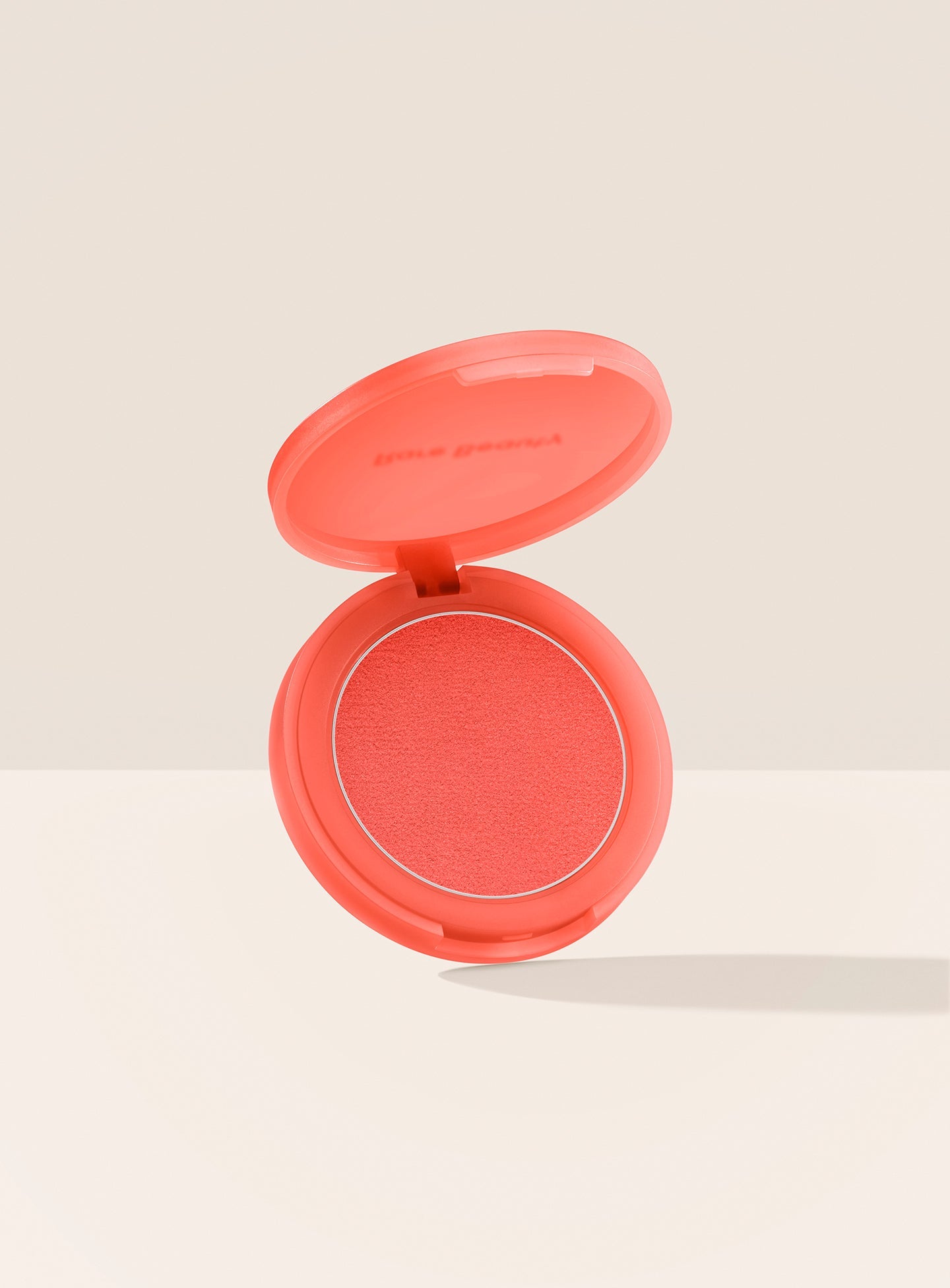 Alive| Rare Beauty's Soft Pinch Matte Bouncy Blush in the bright coral orange shade Alive.