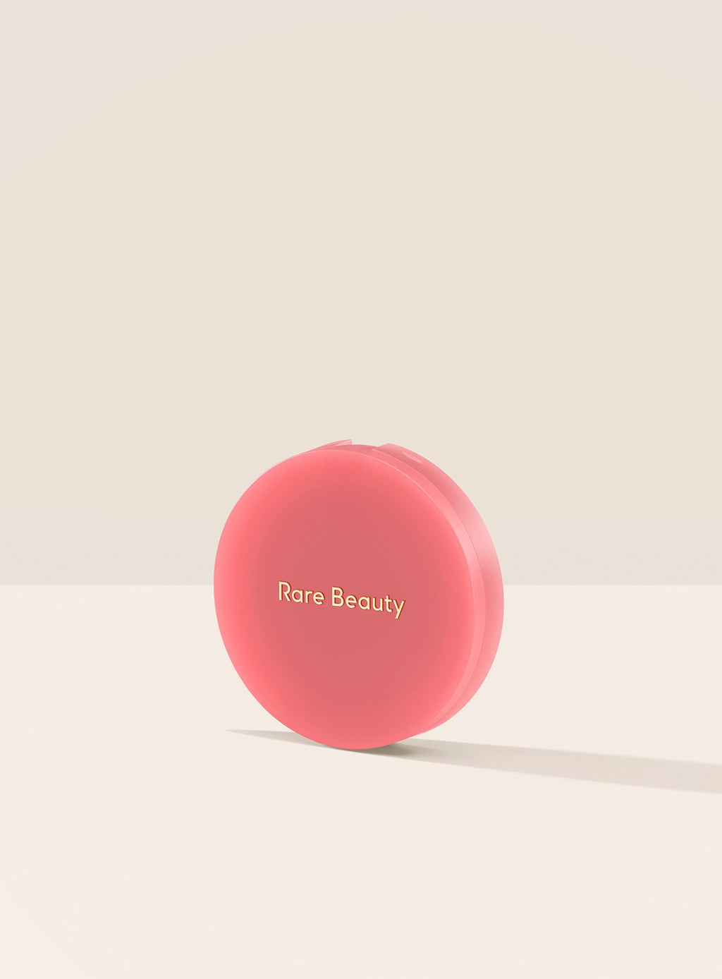 Happy| A closed container of Rare Beauty's Soft Pinch Matte Bouncy Blush in the shade Happy.