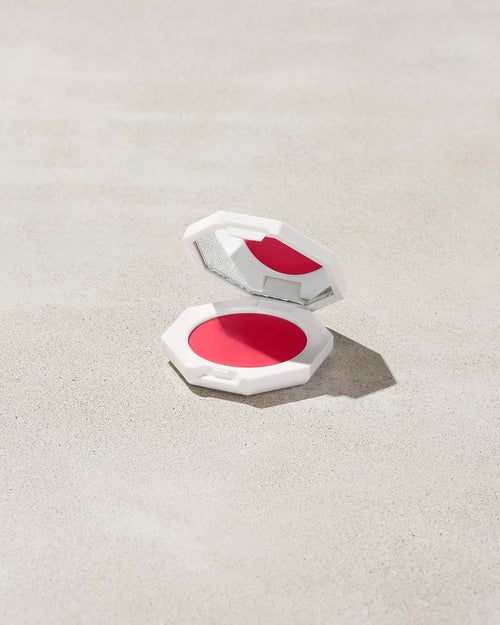 Cheeks Out Freestyle Cream Blush shown in shade Strawberry Drip