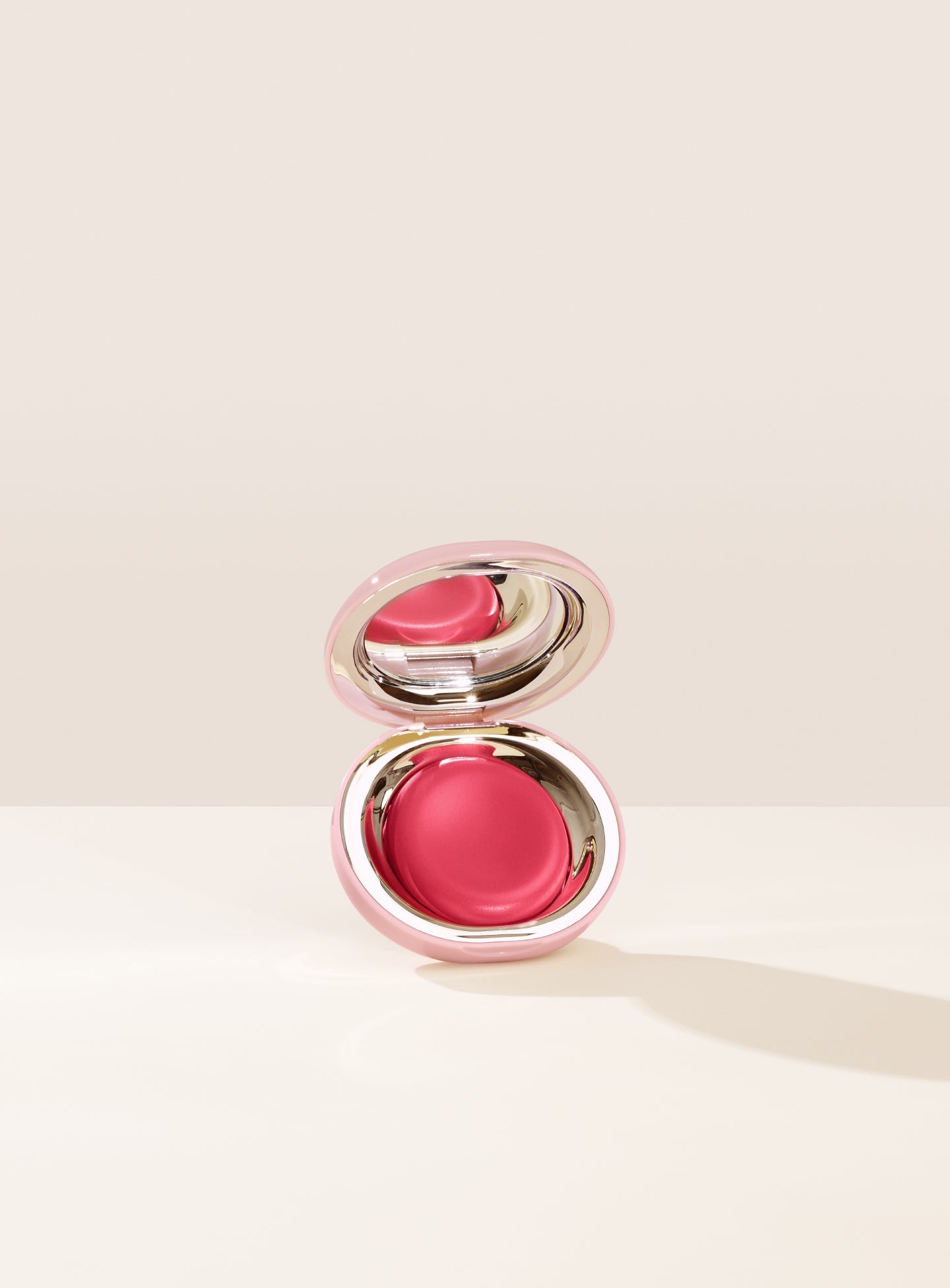 Nearly Rose| Shade Nearly Rose, in a true pink, of Rare Beauty's Stay Vulnerable Melting Blush. 