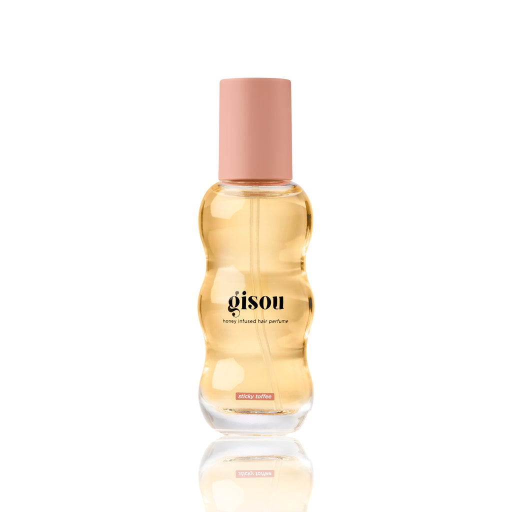 Gisou Honey Infused Hair Perfume in Sticky Toffee 15ml with a warm golden formula and light brown cap, highlighting the rich, toffee-inspired scent.