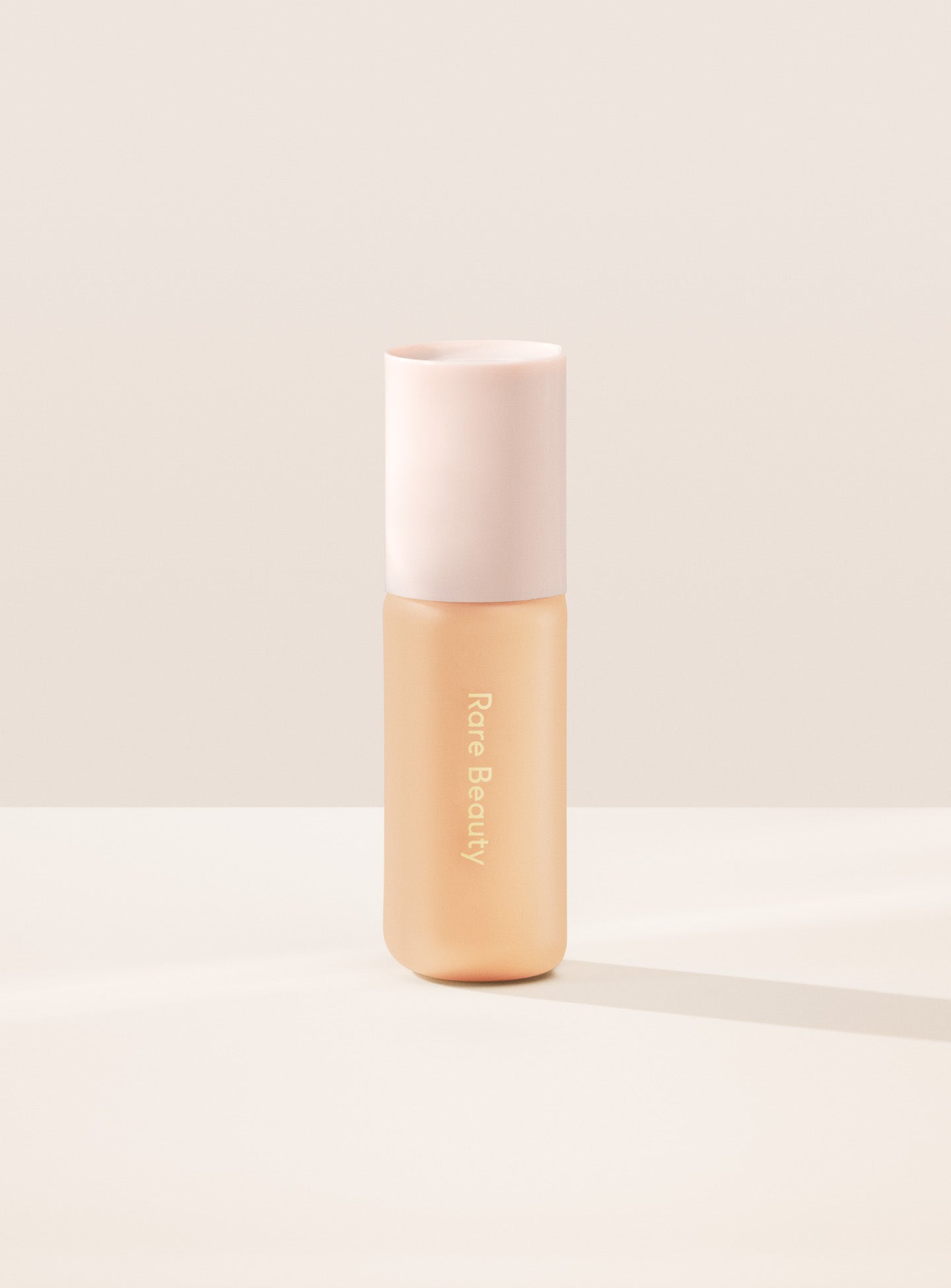 20W| Shade 20W, Light Medium with Warm Undertone, of Rare Beauty's Positive Light Tinted Moisturizer with SPF.