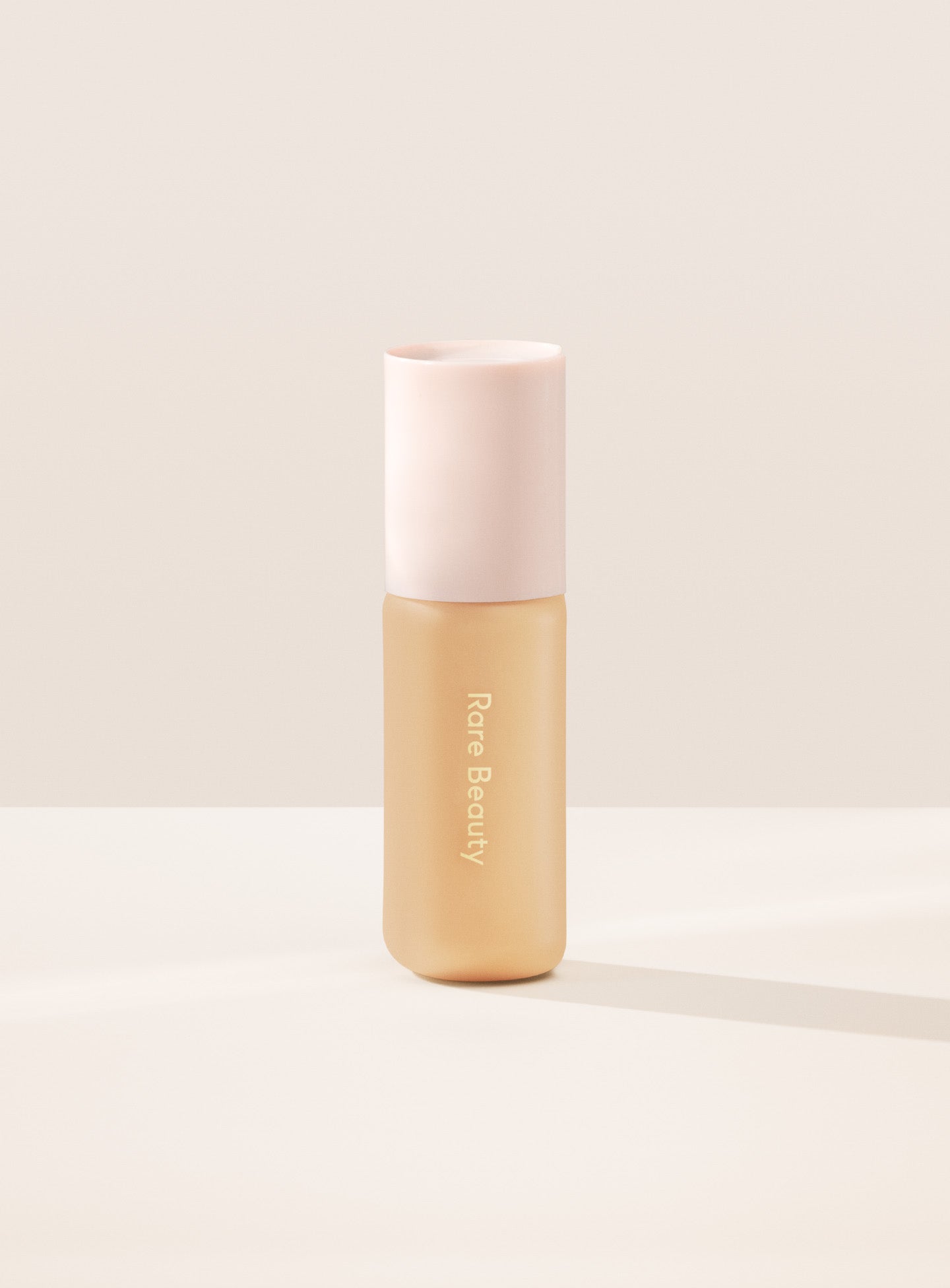 22W| Shade 22W, Light Medium with Warm Golden Undertone, of Rare Beauty's Positive Light Tinted Moisturizer.