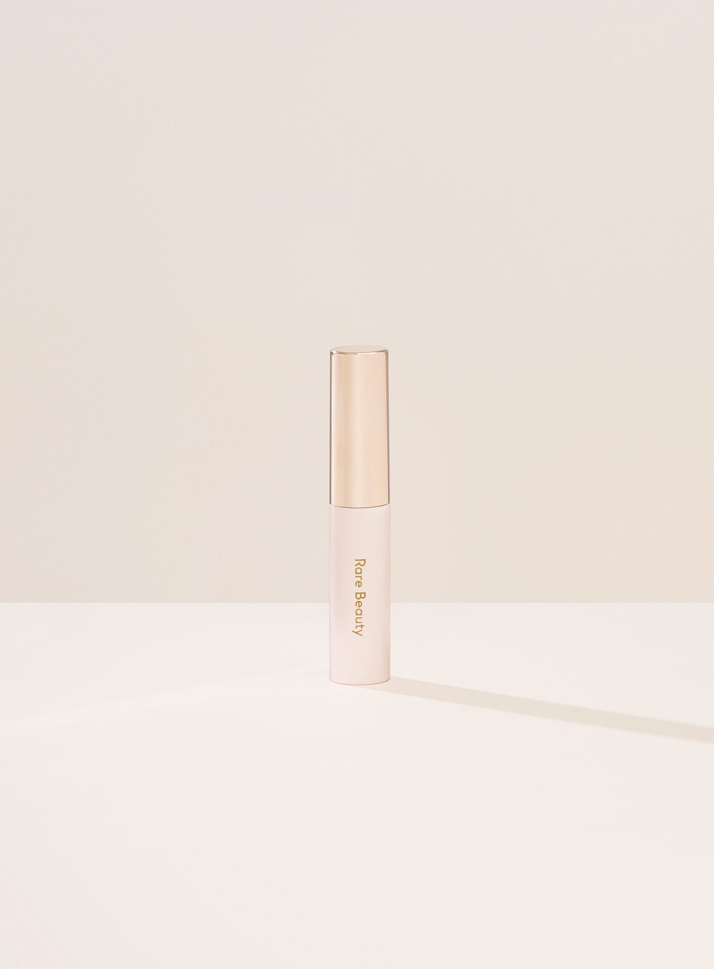 Clear| Minimalistic image of Rare Beauty's Brow Harmony Flexible Lifting Gel packaging.
