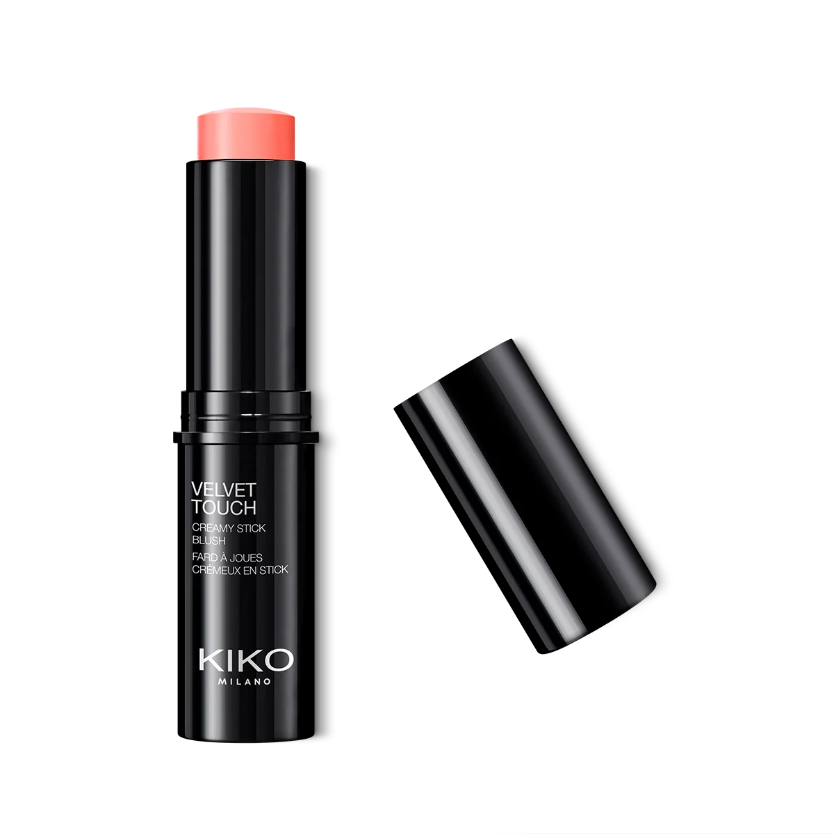 Velvet cream blush stick, blendable, radiant finish. Model applying to cheek. Image 10 of 28.