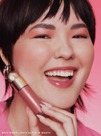 Worth| Rare Beauty's Soft Pinch Liquid Blush in the dewy true rose shade "Worth" applied on a model.